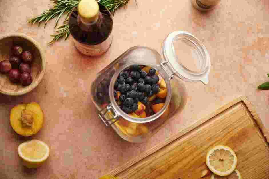 Moscato Sangria Recipe: Gently add the remaining sliced fruit to the bowl to keep it from breaking.