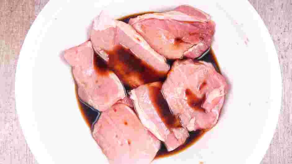 Vietnamese Pork Chops Recipe: Add the thinly sliced boneless pork chops and thoroughly coat each piece.