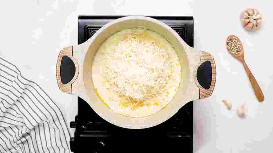 Crab Mac and Cheese Recipe: Whisk in the shredded Parmesan and Gruyere.