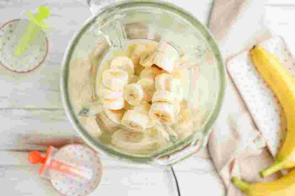 Banana Popsicles Recipe: In the bowl of a blender or food processor, add the chopped ripe bananas, evaporated milk and vanilla extract.