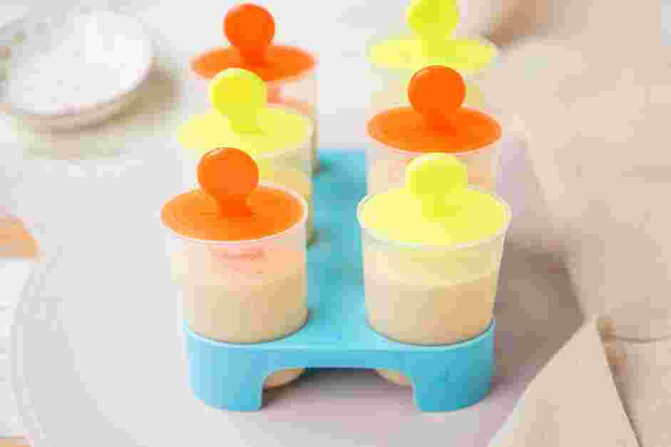 Banana Popsicles Recipe: Fill each popsicle mold ¾ of the way with the strawberry mixture.