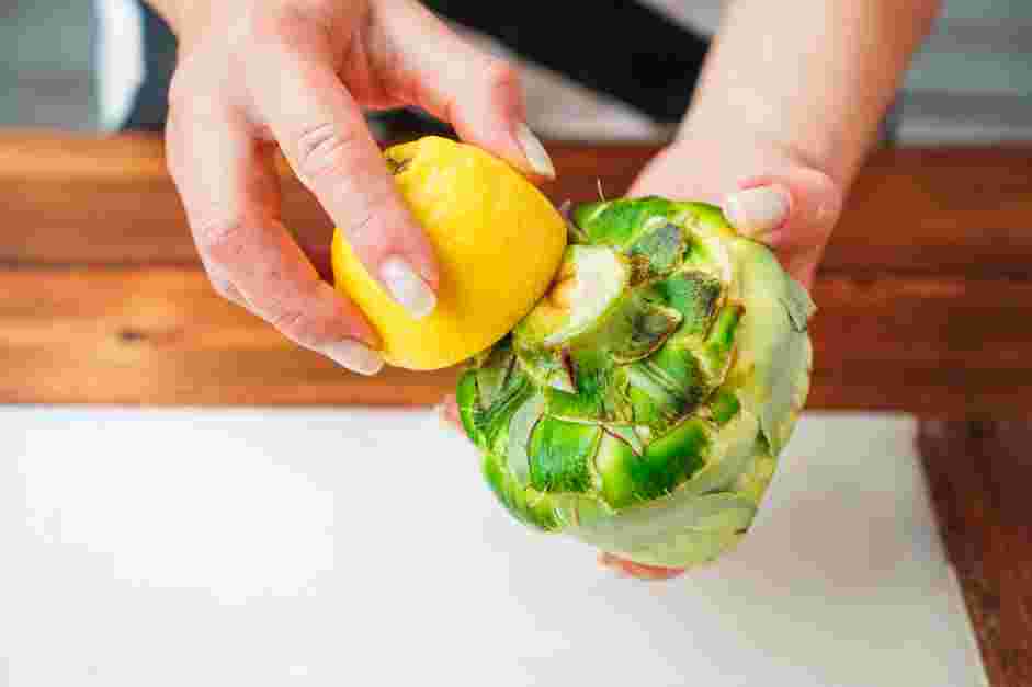 How to Cook Artichokes Step 2: Wash the artichokes to get rid of dirt or grit that may be caught between the leaves and rub both ends with lemon juice to prevent browning.