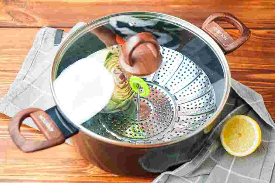 How to Cook Artichokes Step 4: Place your steamer basket into a pot.
