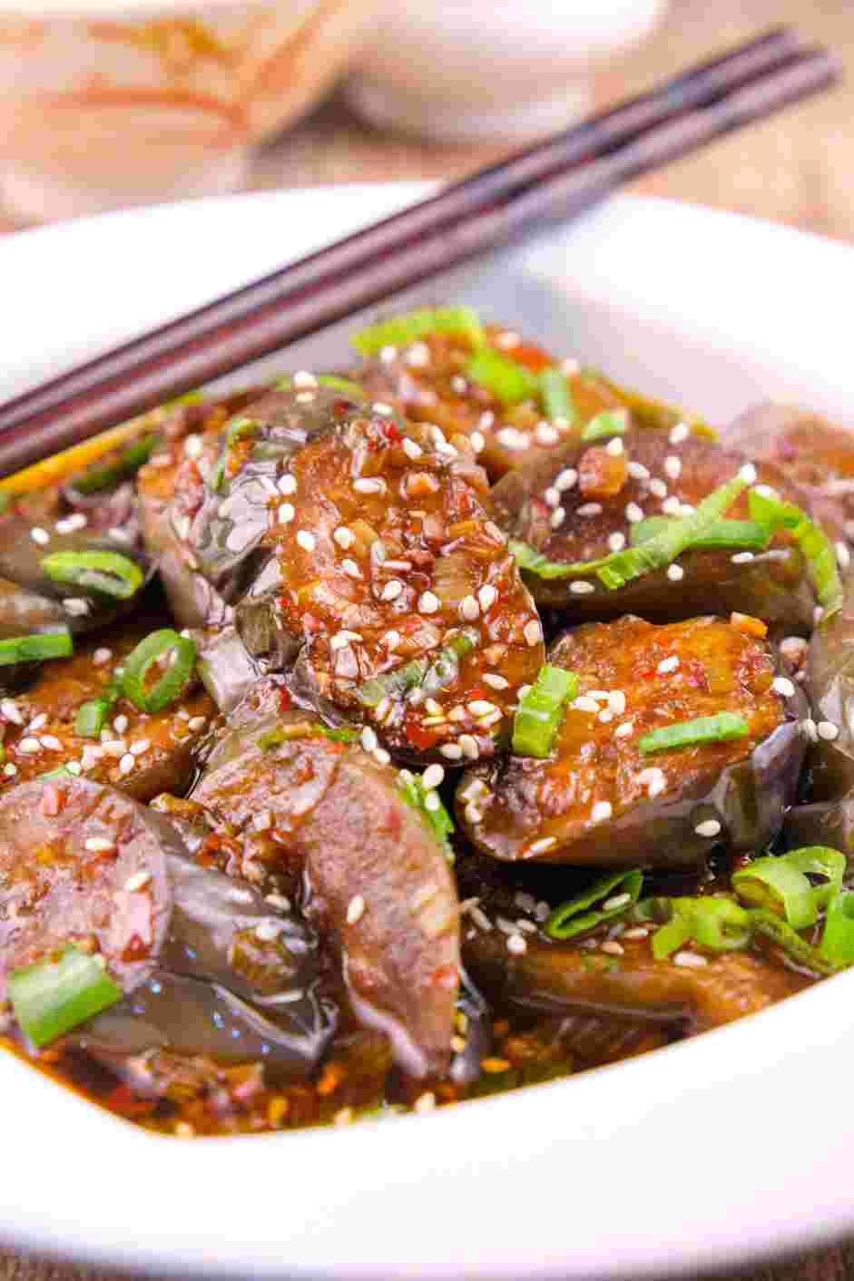 Chinese Eggplant Recipe: Remove the eggplant from the wok and scoop it into a bowl for serving.