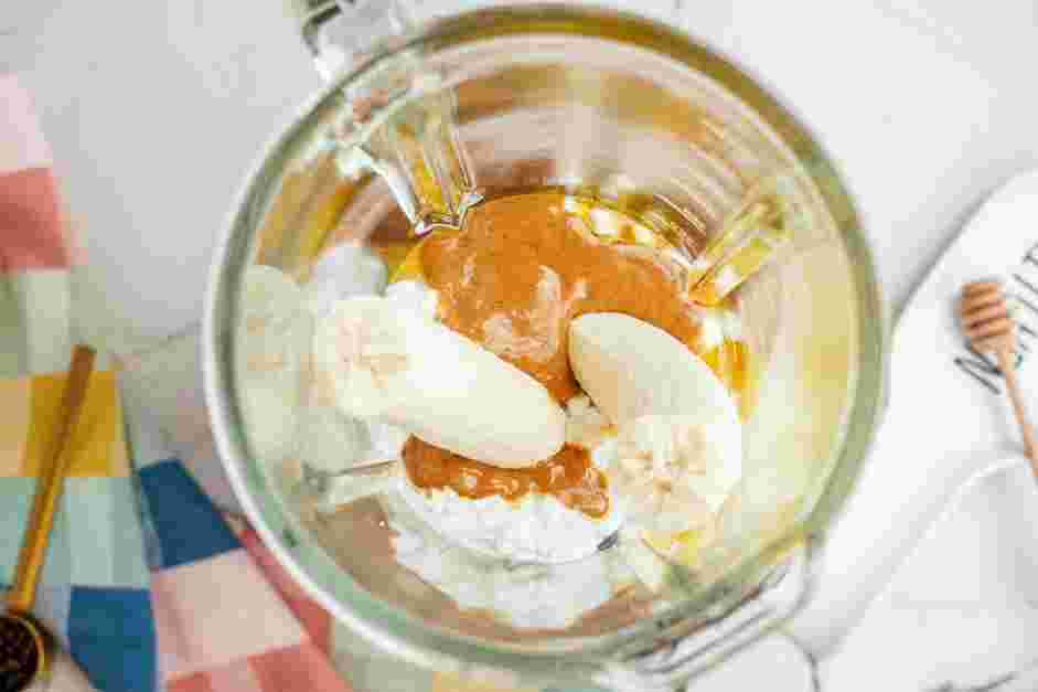 Cottage Cheese Ice Cream Recipe: In a food processor or a blender, add the cottage cheese, honey (or maple syrup), two tablespoons of peanut butter, banana and vanilla extract.