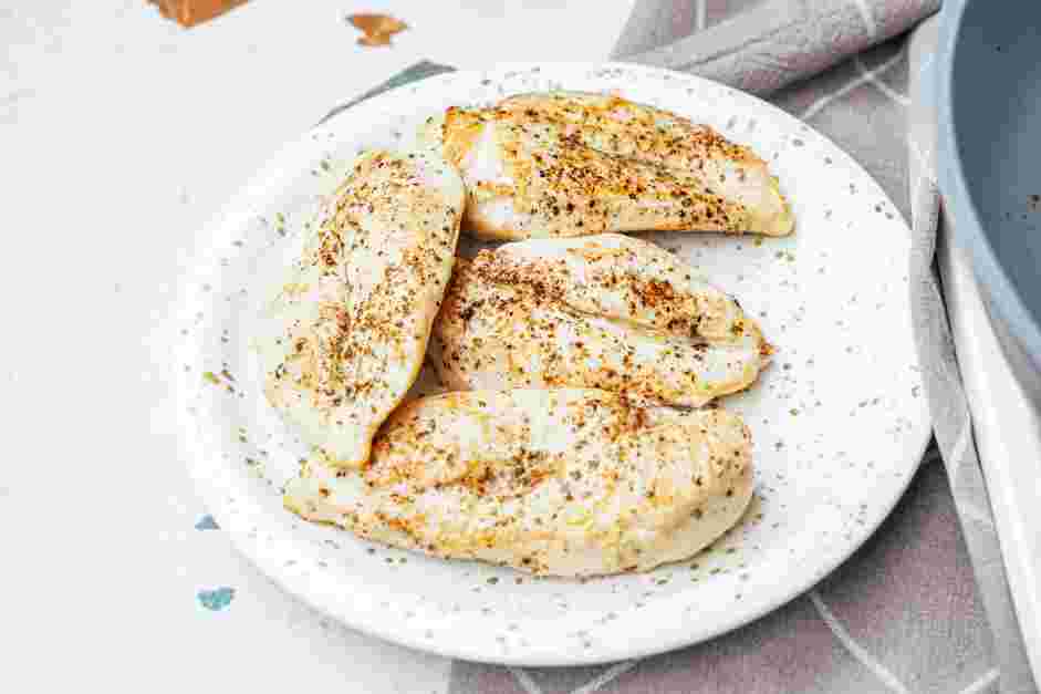 Garlic Parmesan Chicken Pasta Recipe: Remove the chicken breasts from the skillet and transfer to a plate.