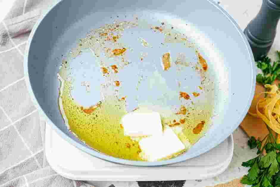 Garlic Parmesan Chicken Pasta Recipe: Add unsalted butter to the skillet.