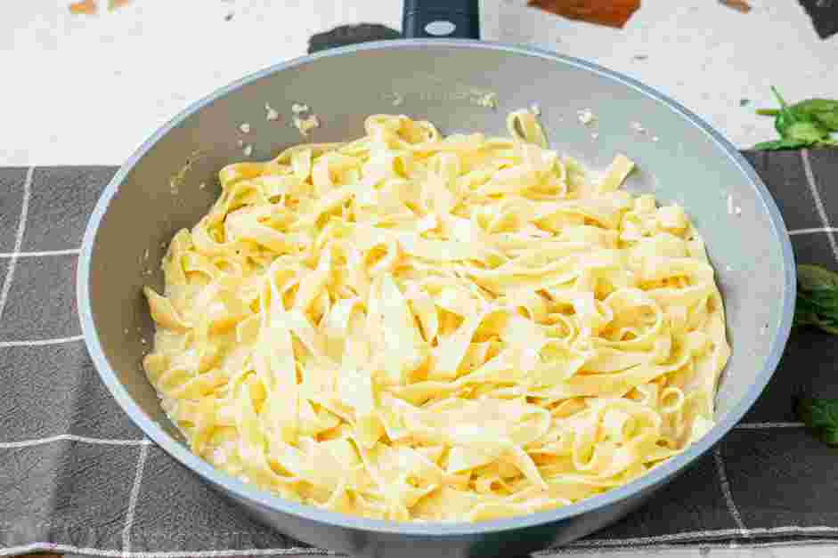 Garlic Parmesan Chicken Pasta Recipe: Reduce the heat to a simmer and cook for about 18-20 minutes or until al dente, stirring occasionally to keep the noodles from sticking.