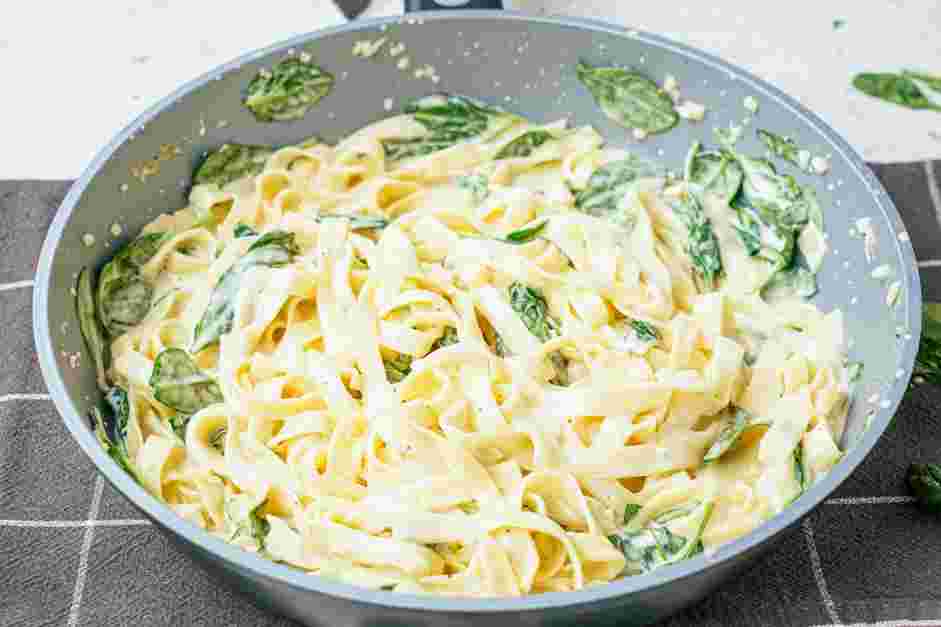 Garlic Parmesan Chicken Pasta Recipe: Remove the pasta from the heat and stir in the heavy cream and the Parmesan cheese.