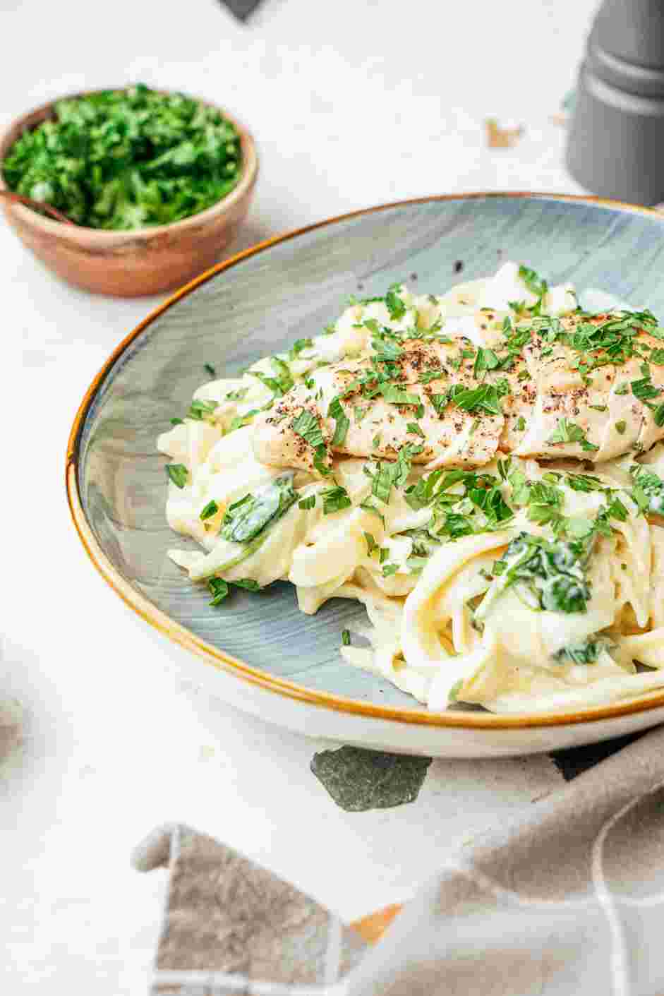 Garlic Parmesan Chicken Pasta Recipe: Slice the chicken breasts and toss with the sauce or serve the sliced chicken breasts on top of the pasta.