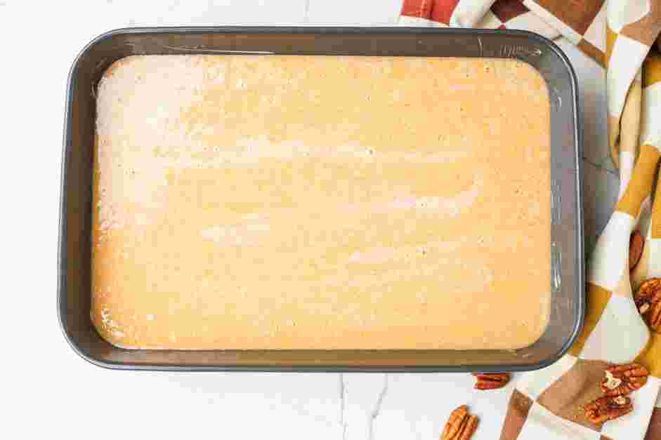 Pumpkin Dump Cake Recipe: Pour the pumpkin custard into the prepared baking dish.