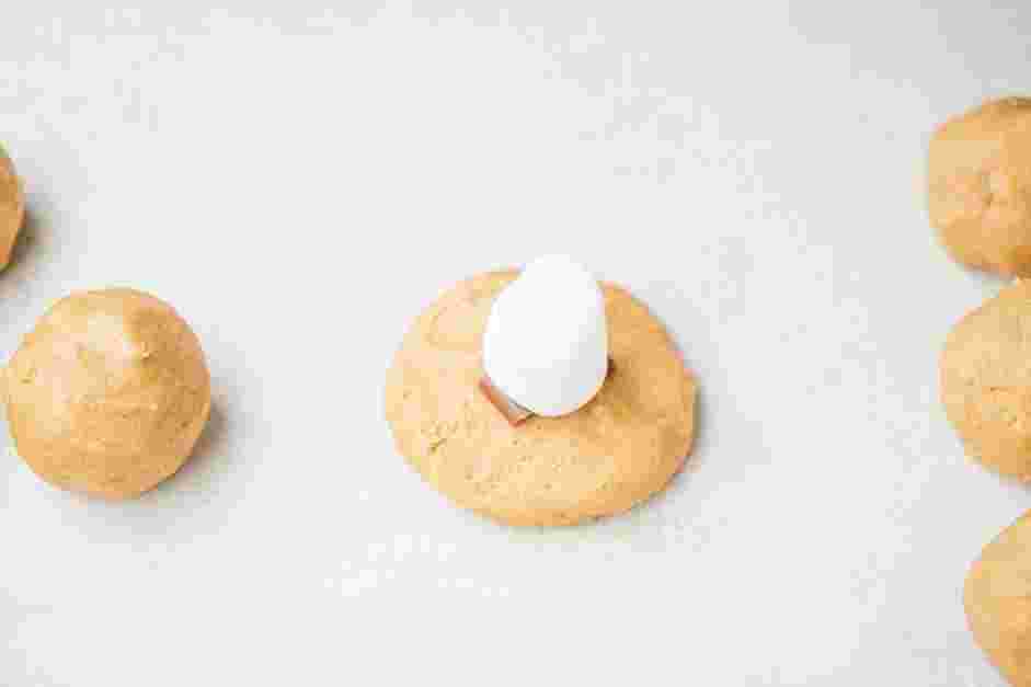 S’mores Cookies Recipe: Flatten one ball into the palm of your hand.