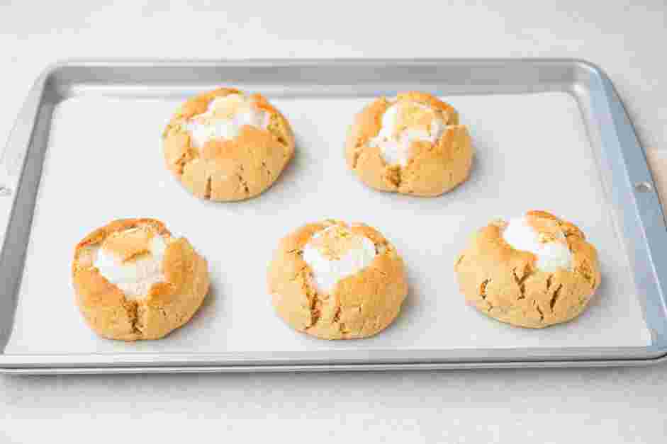 S’mores Cookies Recipe: Bake for about 15 minutes until the marshmallow puffs up slightly and the bottom of each cookie is brown.