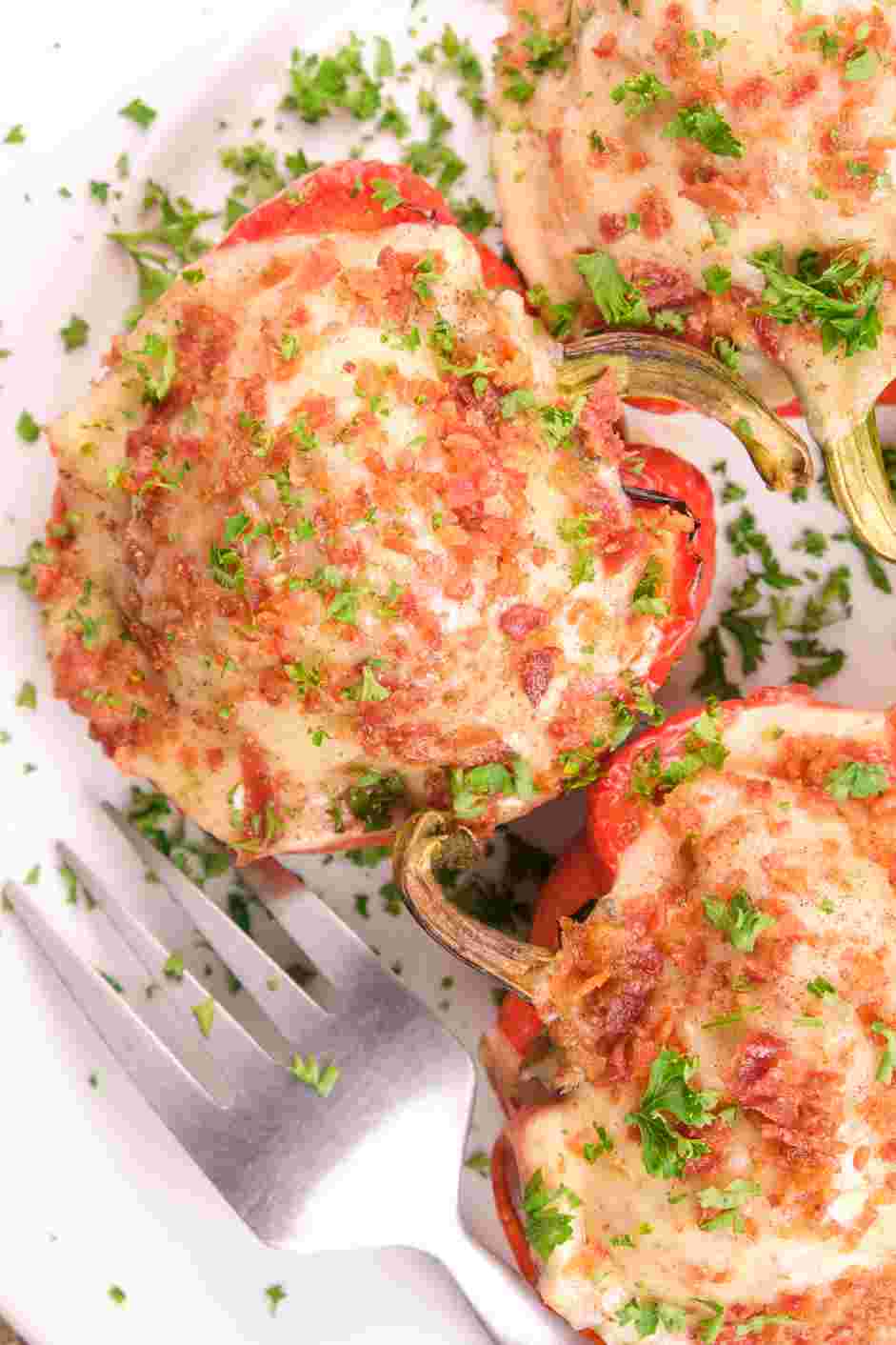 Keto Stuffed Bell Peppers Recipe: Return to the oven to continue baking until the cheese melts and the egg has reached the desired consistency, about 8 minutes.