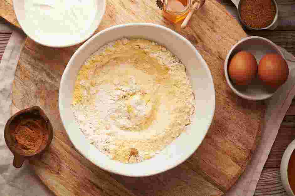Sweet Potato Cornbread Recipe: In a large mixing bowl, whisk together the cornmeal, all-purpose flour, baking powder, cinnamon (or pumpkin pie spice) and salt until well combined.
