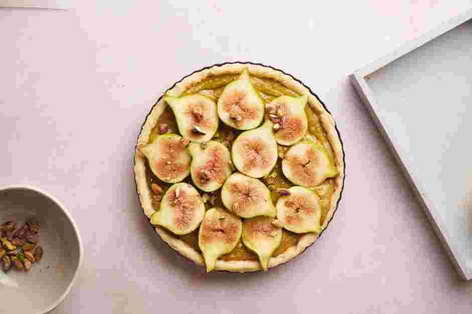 Fig Tart Recipe: Next, cut the figs in half and arrange them in a circle evenly spread apart with the exposed fruit side up.