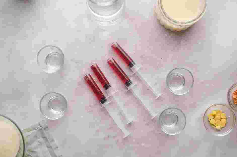 Halloween Jello Shots Recipe: Remove the covered tip of each syringe.