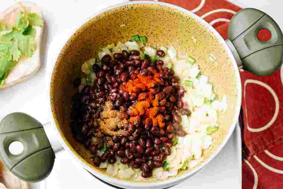 Black Bean Crunchwrap Supreme Recipe: Add the drained beans, chili powder, cumin and smoked paprika.