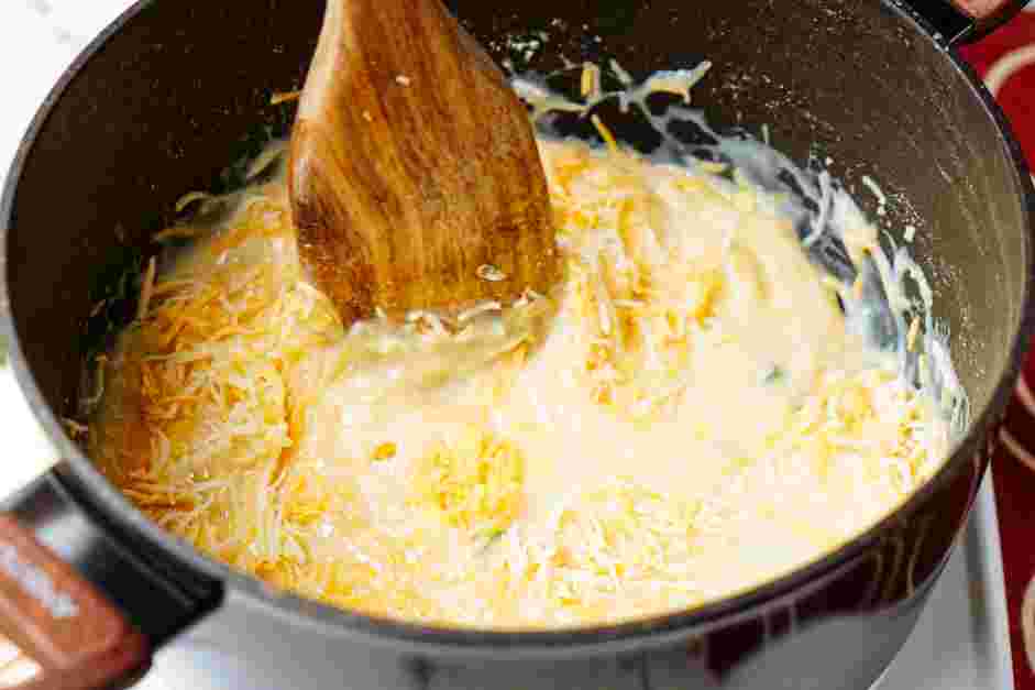 Black Bean Crunchwrap Supreme Recipe: Once the mixture simmers, add the shredded cheese.