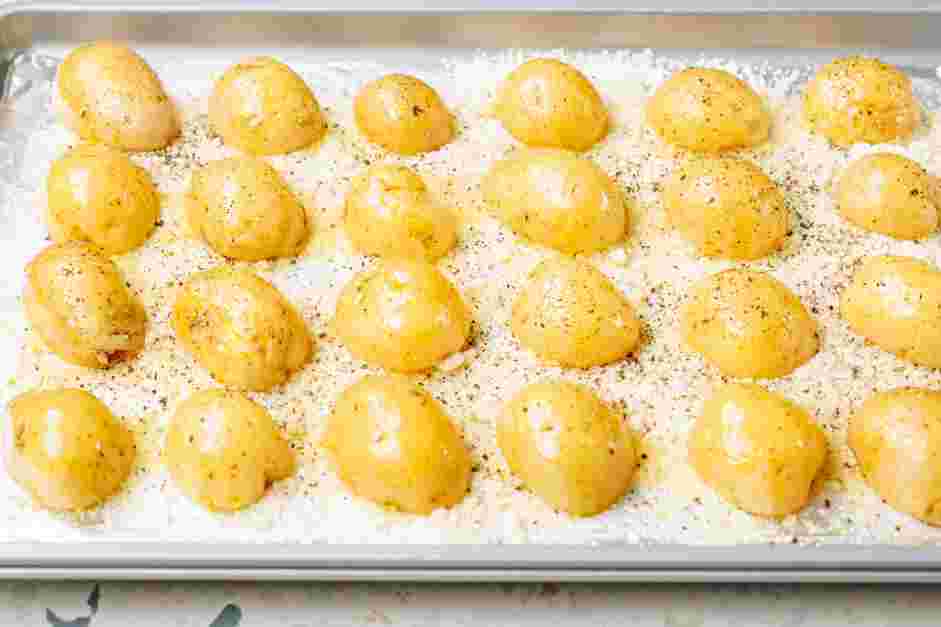 Parmesan Crusted Potatoes Recipe: Place the potatoes face down on the prepared baking sheet.