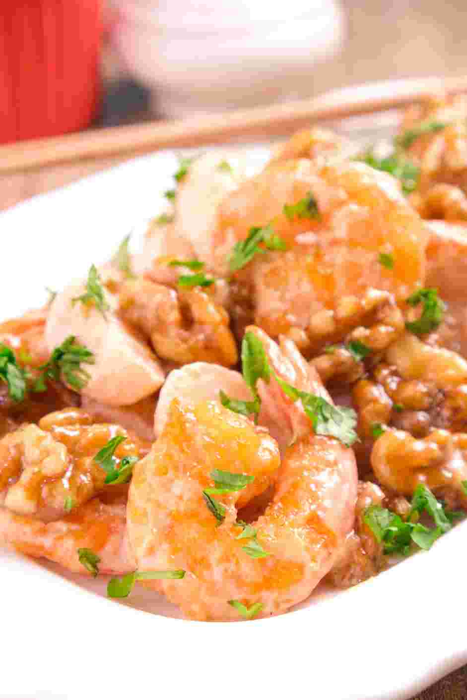 Honey Walnut Shrimp Recipe: Serve hot, with cilantro on top, paired with brightly colored, steamed vegetables.