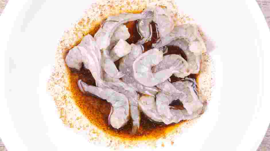 Blackened Shrimp Recipe: Using gloved hands, toss the shrimp with the seasoning mixture to completely coat the shrimp.