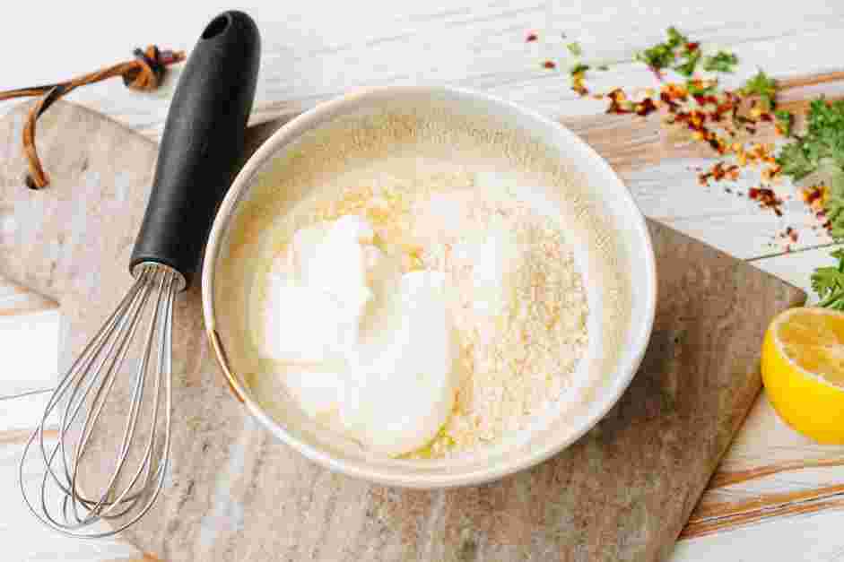 Garlic Parmesan Wings Recipe: In a bowl, whisk together the Parmesan, mayonnaise and lemon juice.