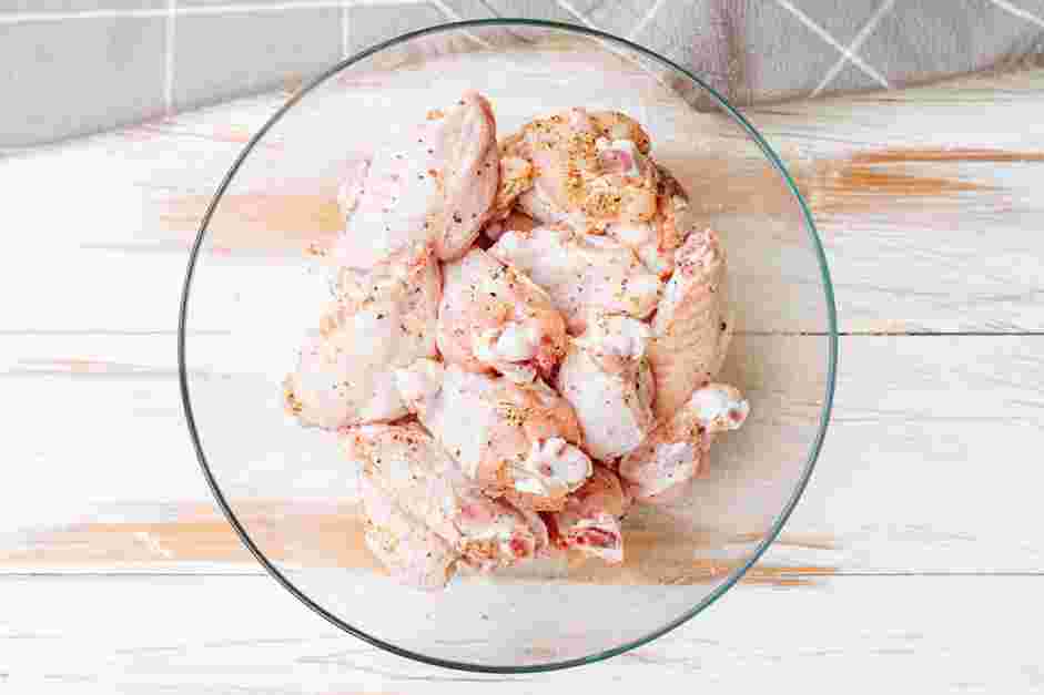 Garlic Parmesan Wings Recipe: Place the flats and drummettes into a large bowl.