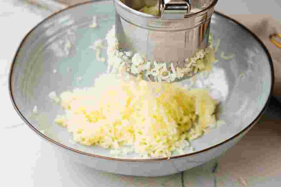 Potato Candy Recipe: Once the potato is done, use a ricer or a fork to mash the potatoes until completely smooth.