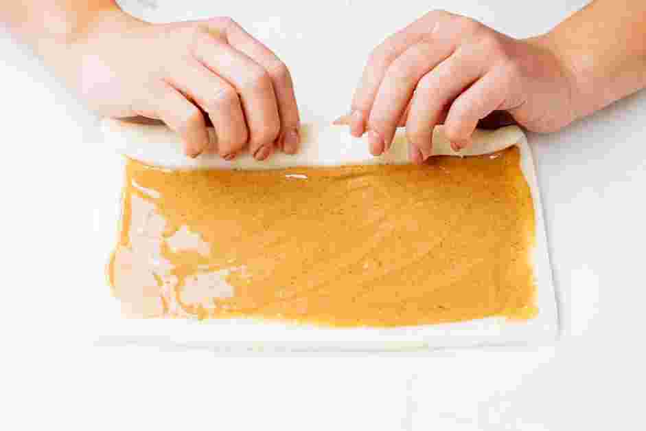 Potato Candy Recipe: Lift the long edge of the dough and roll the dough into a tight log.