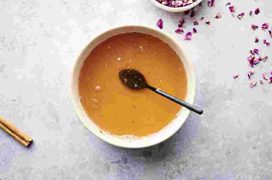 Baklava Cheesecake Recipe: Use a fine mesh strainer to strain the honey syrup and stir in the ground cinnamon and rose water, if using.