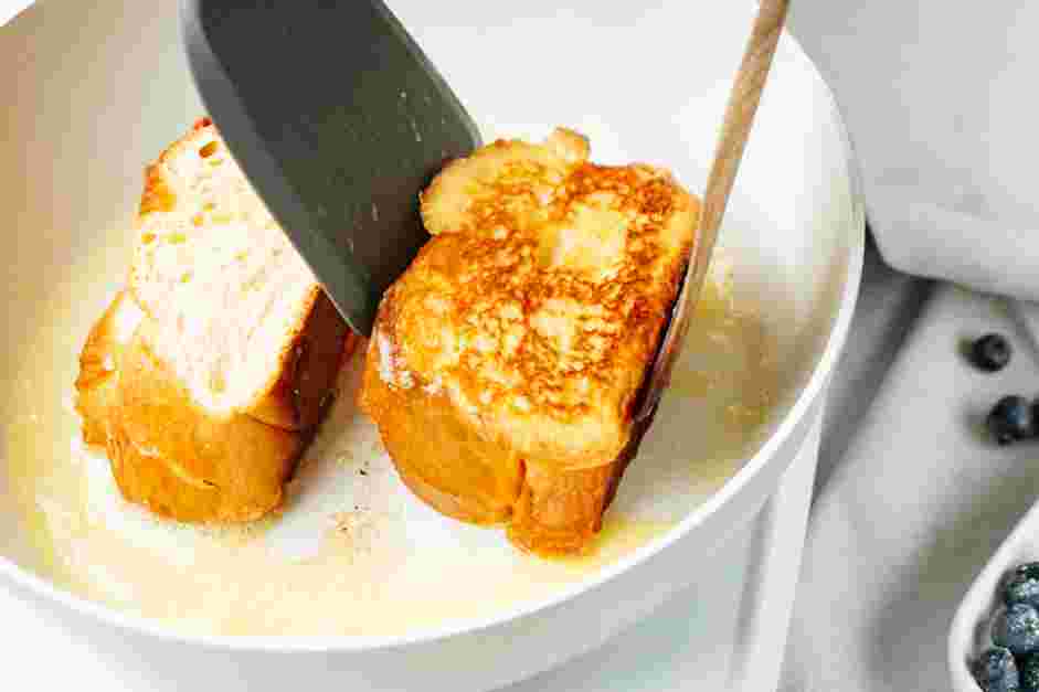 Creme Brulee French Toast Recipe: In a large nonstick skillet over medium heat, melt two tablespoons of butter.