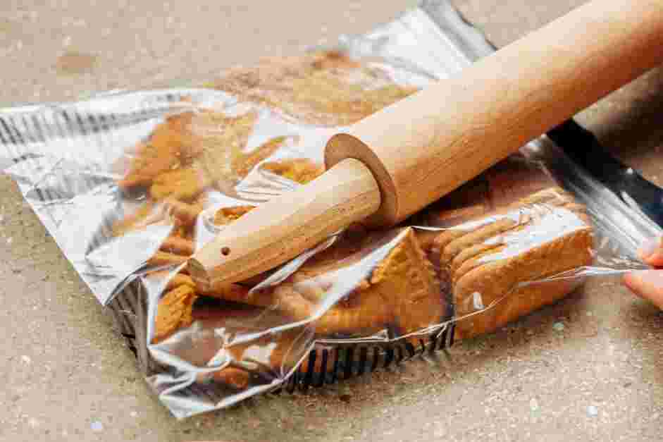 Speculoos Cookie Butter Recipe: Use a rolling pin to break the cookies into rough crumbs, then pour them into a medium bowl.