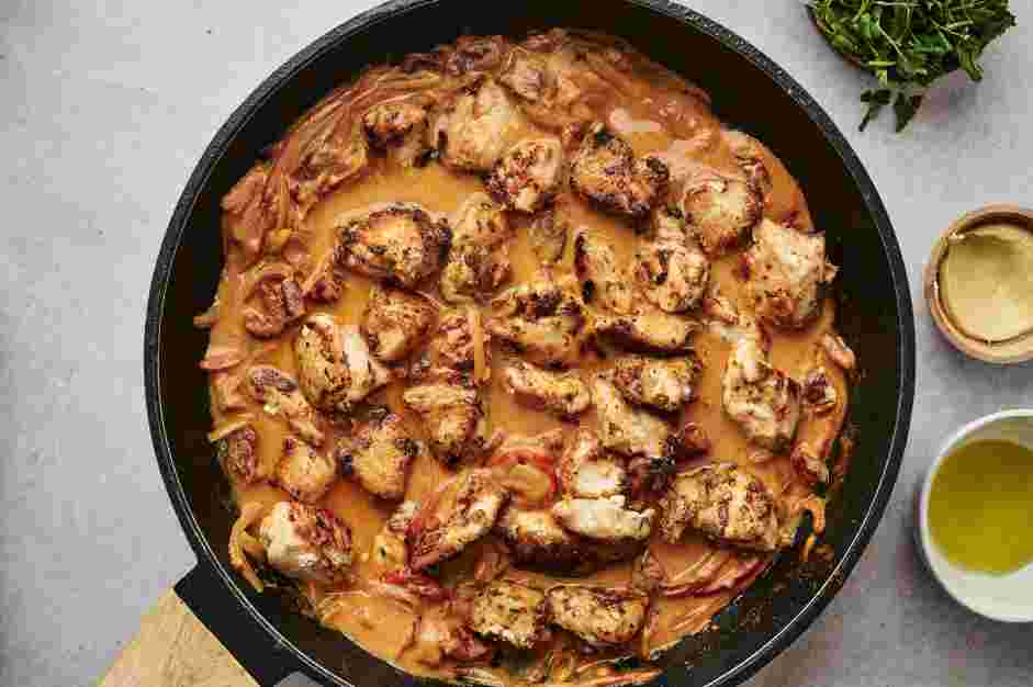 Tuscan Chicken Pasta Recipe: Add the cooked chicken back to the pan and cook until the chicken is cooked through and the sauce is thickened.