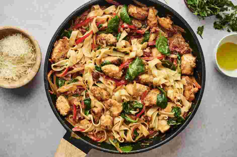 Tuscan Chicken Pasta Recipe: Drain the pasta and toss with the sauce.