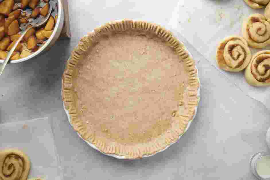 Cinnamon Roll Apple Pie Recipe: Transfer the pie dough into a 9-inch pie pan.