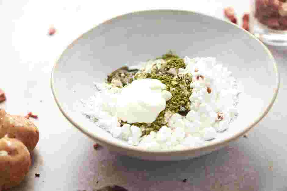 Mochi Donuts Recipe: For the matcha glaze, whisk together the powdered sugar, heavy cream, vanilla extract and matcha powder until smooth.