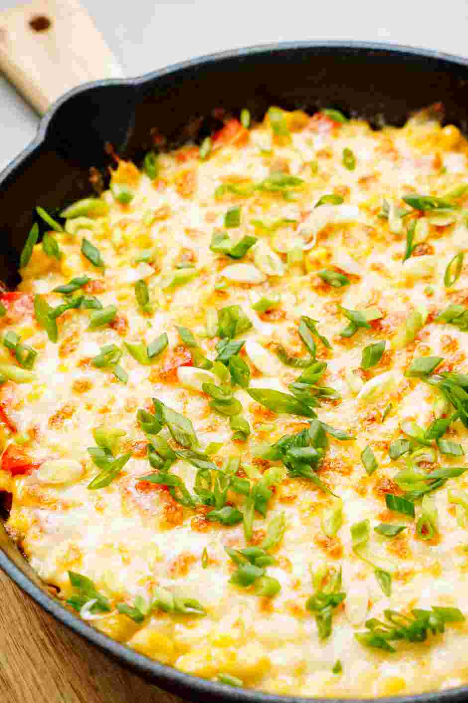 Korean Corn Cheese Recipe: Sprinkle with the scallions and enjoy while it's hot and cheesy!