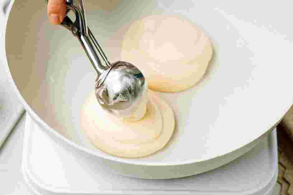 Souffle Pancakes with Miso Maple Syrup Recipe: Remove the cover and add two tablespoons of batter on top of each pancake.