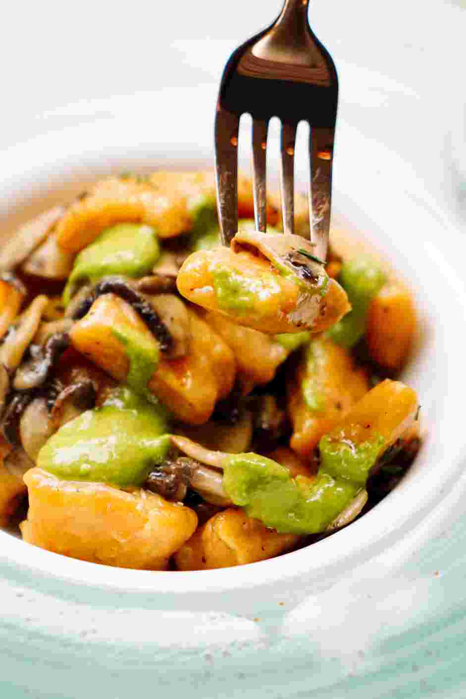 Sweet Potato Gnocchi with Mushroom and Pesto Sauce Recipe: Serve on a plate with a drizzle of balsamic vinegar and basil pesto for taste and garnish.