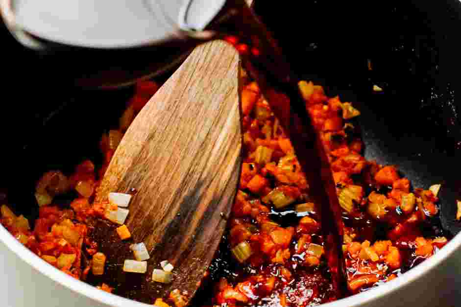 Lamb Shank Recipe: Deglaze the pot with the red wine, scraping off the browned bits from the bottom of the pot.