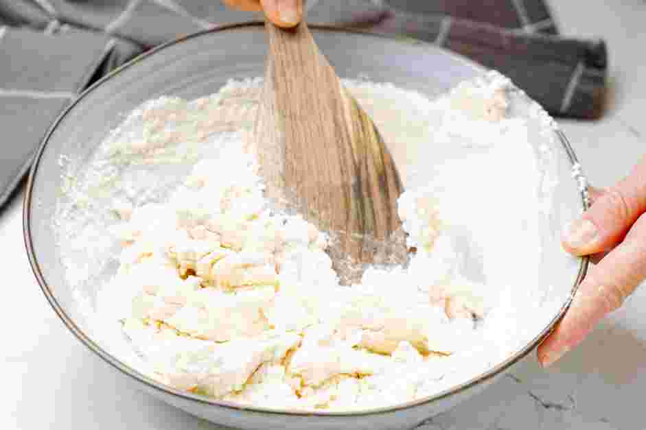 Ricotta Gnocchi with Sage Brown Butter Recipe: Sprinkle the flour over the ricotta mixture and, using a wooden spoon, stir until just combined and a soft dough forms.