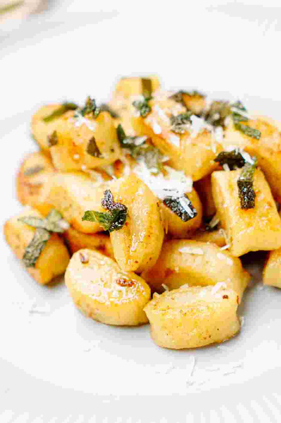 Ricotta Gnocchi with Sage Brown Butter Recipe: Serve immediately, garnished with more Parmigiano-Reggiano cheese.