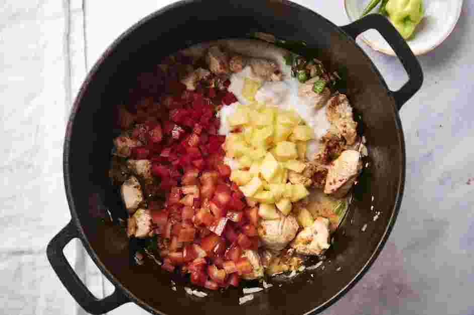 Green Chili Stew Recipe: Pour in coconut milk, diced tomatoes, pineapple chunks, and chopped bell peppers.