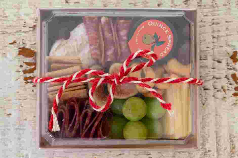 Mini Charcuterie Boxes Recipe: If desired, add a lid to each box and adorn with a decorative and festive ribbon.