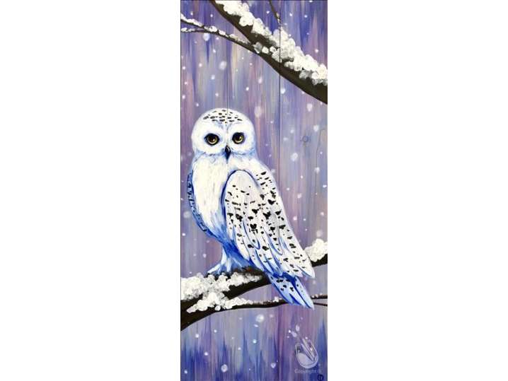 A Curious Snowy Owl Perched at Night