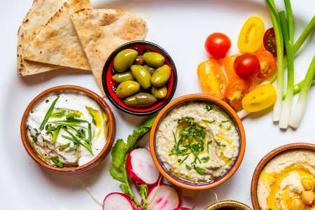 baba ganoush, hummus, olives and pita bread