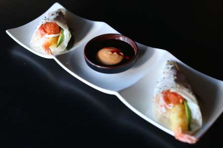 Sushi hand rolls with sauce