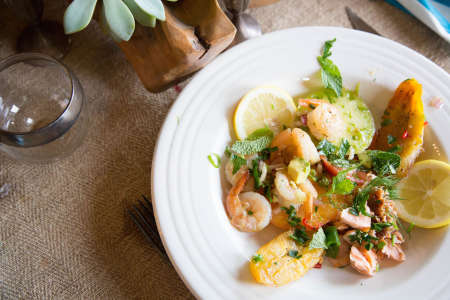 Shrimp and salmon with fried plantains and heirloom tomatoes 