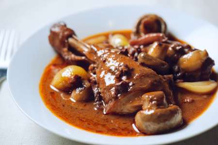 coq au vin on a white plate